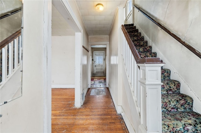 staircase with wood finished floors