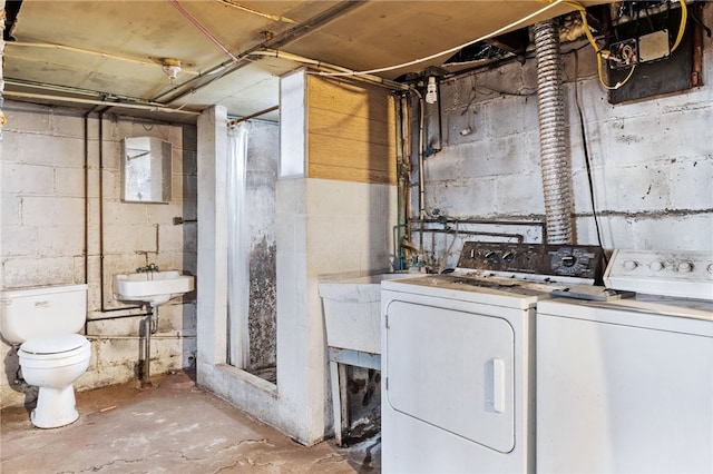 laundry room featuring a sink, laundry area, and washing machine and clothes dryer