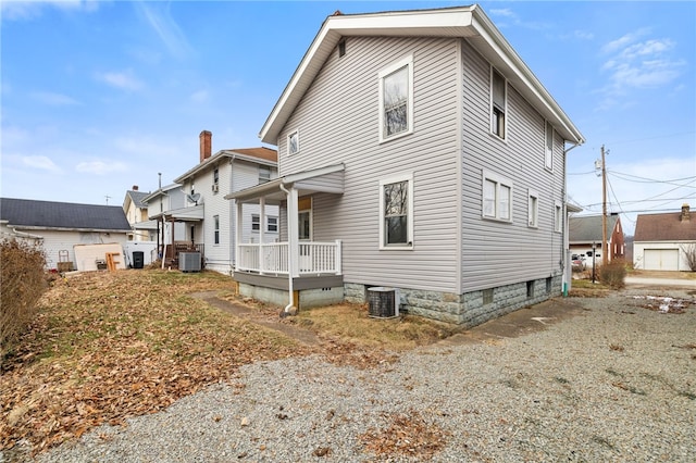 rear view of house with central air condition unit