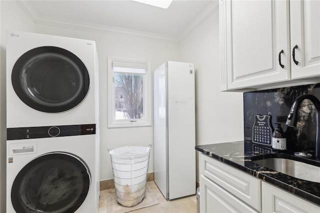 2001 Old Orchard Pl, Adams Twp, PA 15044 - washroom with stacked washing maching and dryer, crown molding, laundry area, and a sink