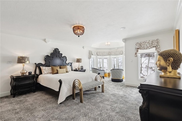 bedroom with baseboards and carpet flooring