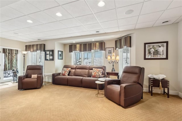 living area featuring a wealth of natural light, light carpet, baseboards, and recessed lighting