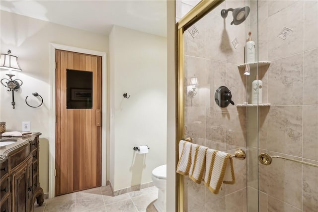 full bathroom with toilet, a stall shower, tile patterned flooring, and vanity