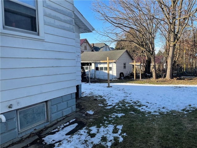 view of yard layered in snow