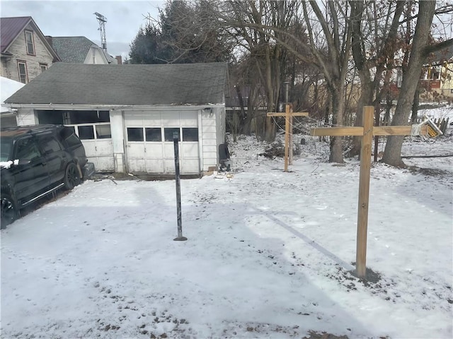 view of snow covered garage