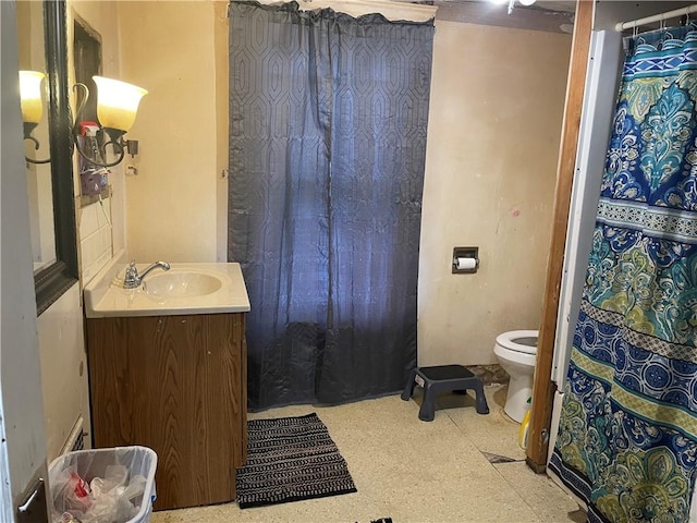 bathroom featuring toilet and vanity