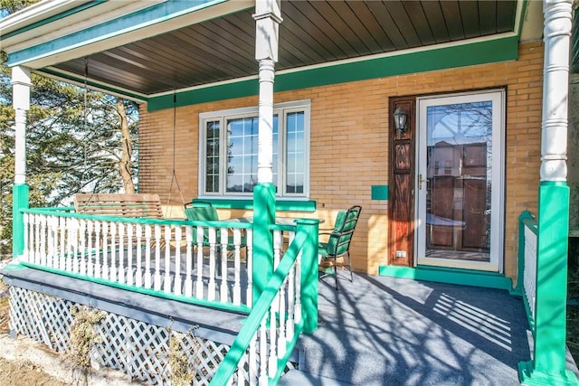 wooden deck featuring covered porch