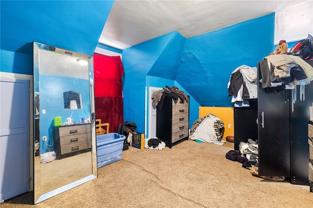 bedroom featuring lofted ceiling and carpet floors