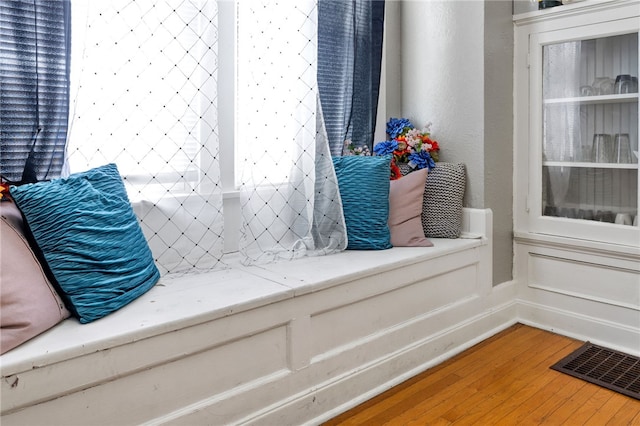 mudroom with visible vents and wood finished floors