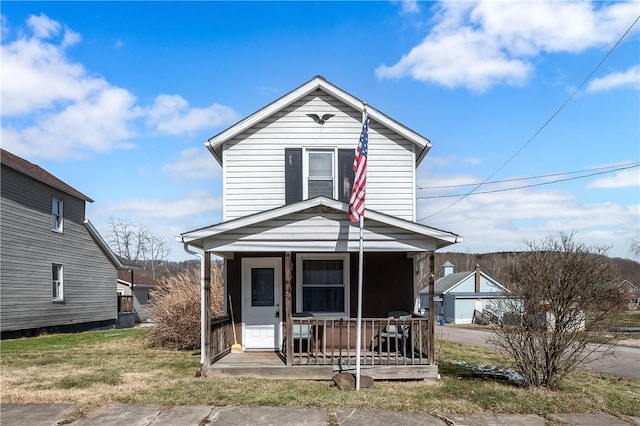 view of front of home featuring covered porch and a front yard