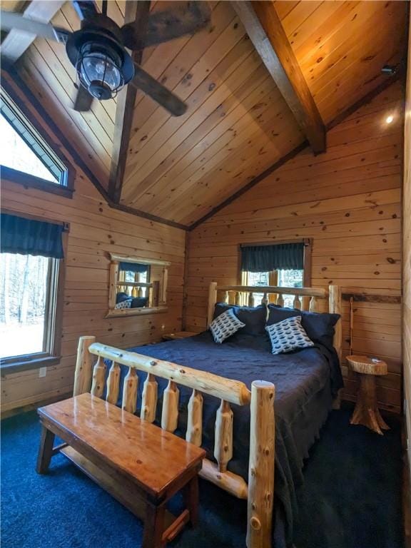 bedroom with dark carpet, wood ceiling, wood walls, and lofted ceiling with beams