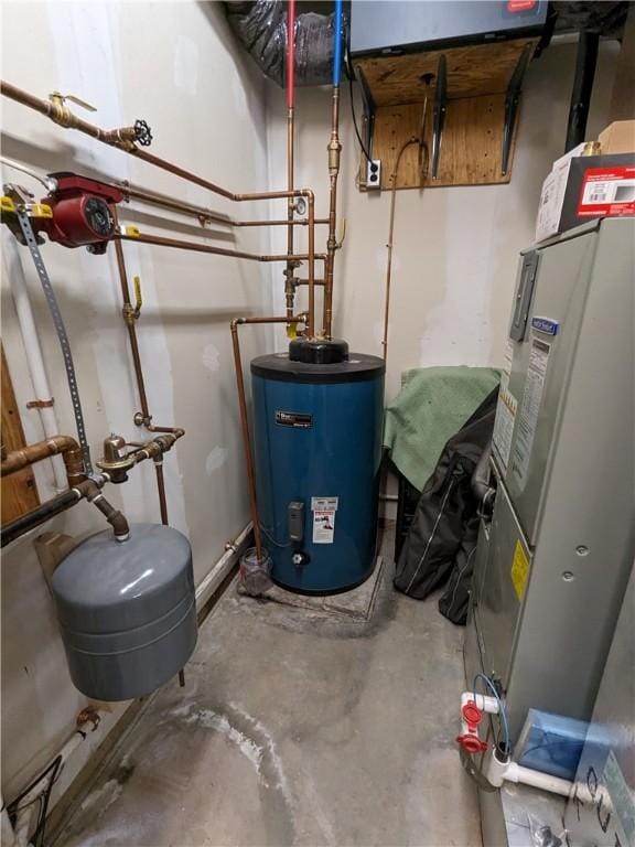 utility room featuring water heater and heating unit