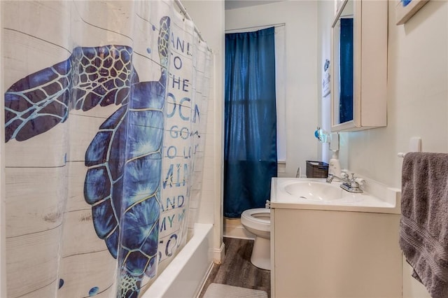 full bathroom featuring toilet, shower / bathtub combination with curtain, wood finished floors, and vanity