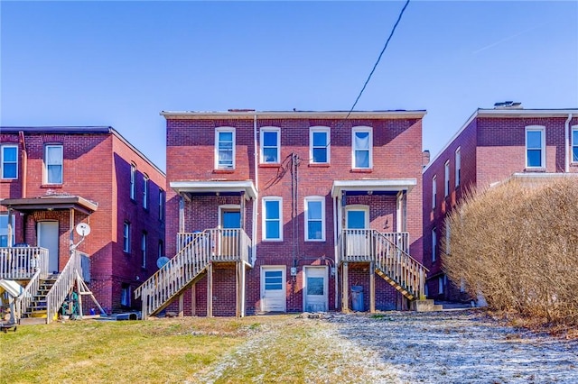 townhome / multi-family property with brick siding