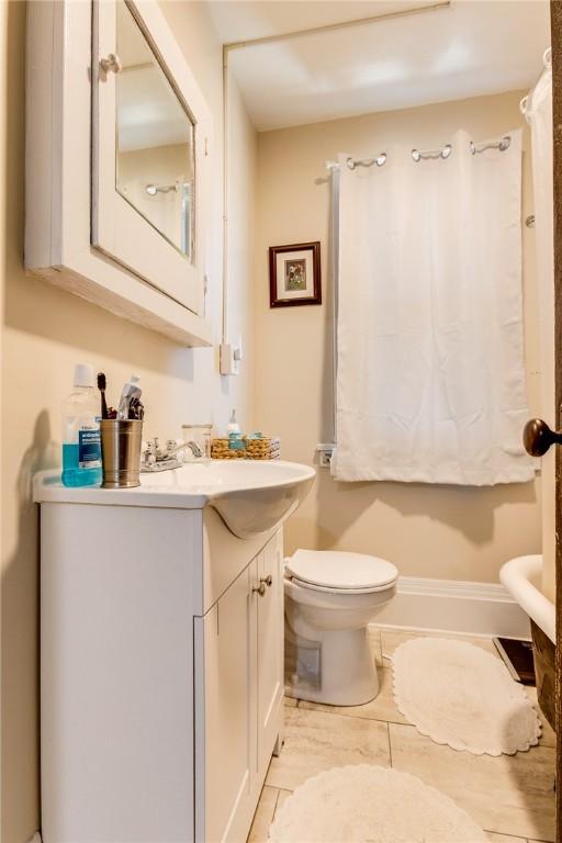 bathroom with toilet and vanity