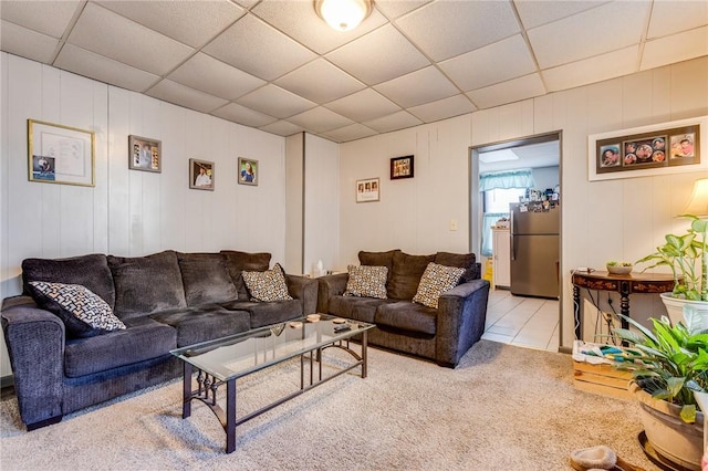 living room featuring a paneled ceiling