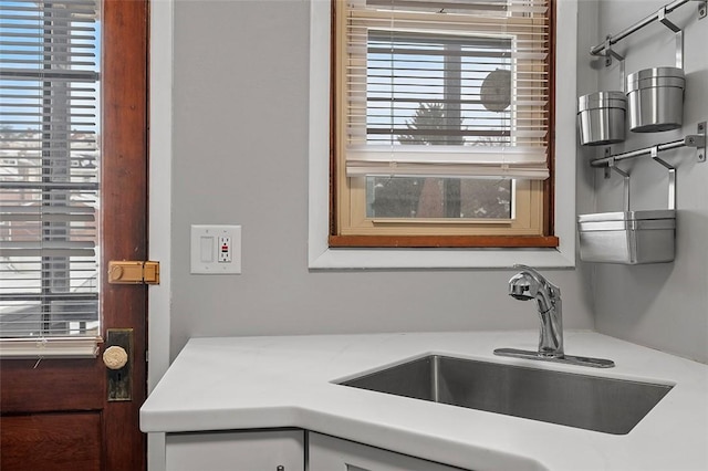 kitchen with light countertops and a sink