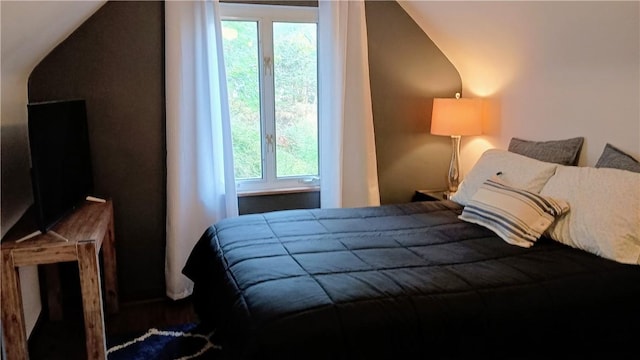 bedroom with vaulted ceiling