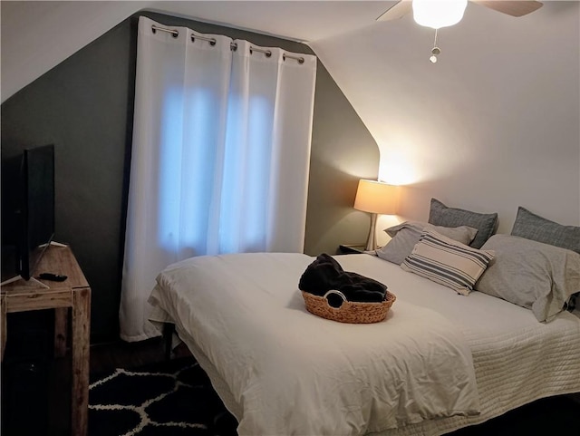 bedroom featuring lofted ceiling and ceiling fan