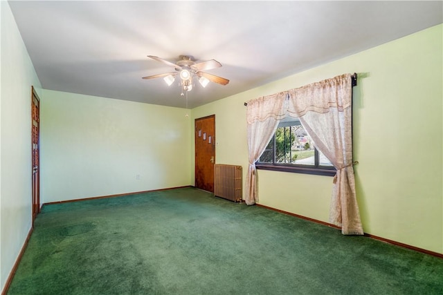 empty room with carpet, baseboards, ceiling fan, and radiator heating unit