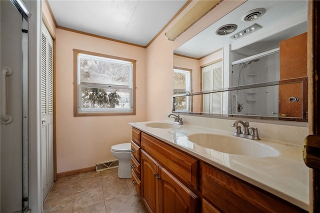 full bath featuring ornamental molding, a closet, a sink, and visible vents