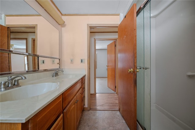 full bath featuring a sink and double vanity