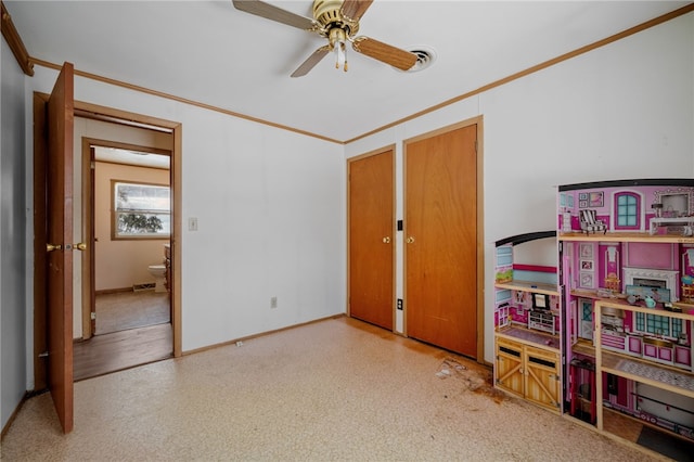 interior space featuring baseboards and ornamental molding