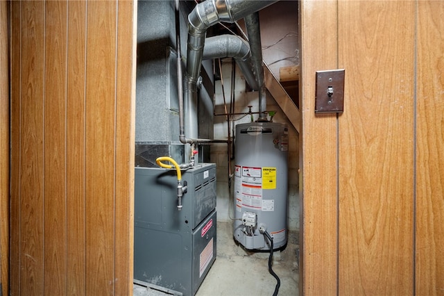 utility room featuring gas water heater