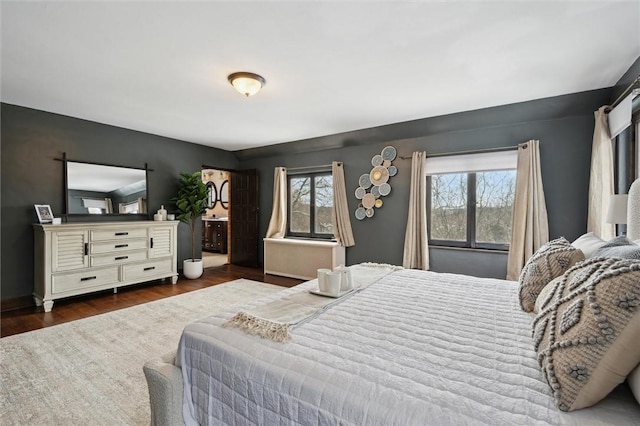 bedroom with dark wood-style floors