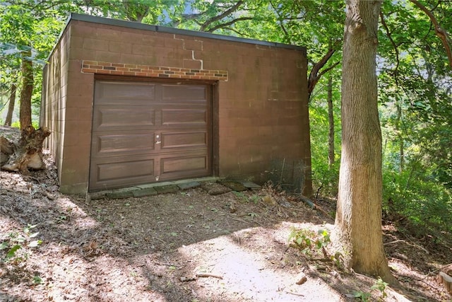 garage featuring driveway