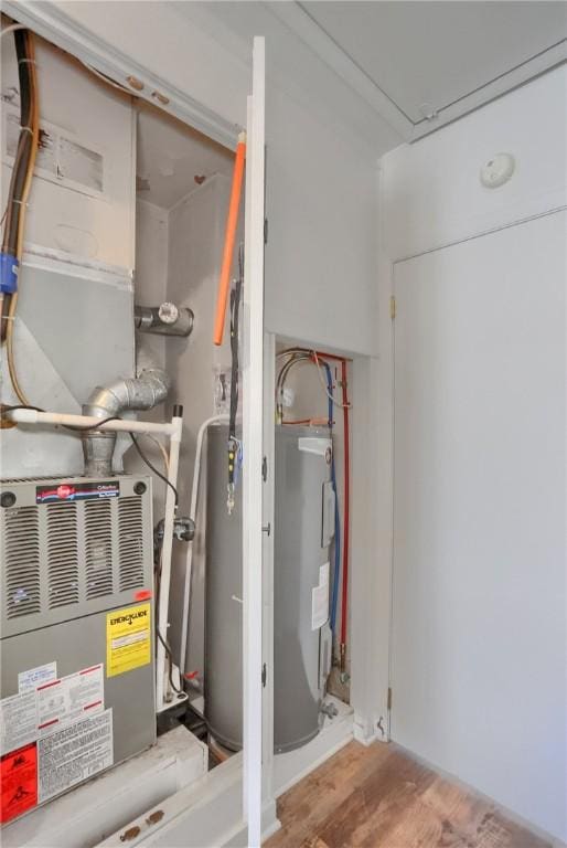 utility room with electric water heater