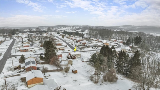 snowy aerial view featuring a residential view