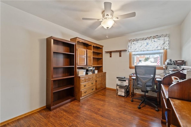 office featuring a ceiling fan, dark wood-style flooring, and baseboards