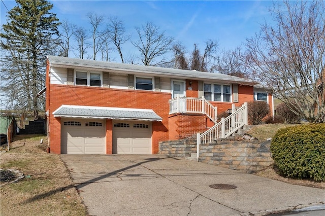 view of front of house featuring an attached garage, concrete driveway, and brick siding