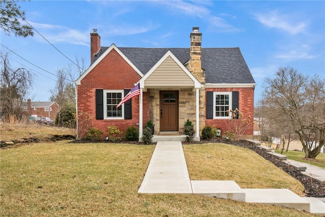 view of front facade with brick siding, a chimney, and a front yard