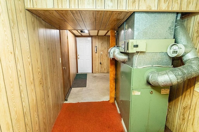 hallway with wooden walls and heating unit