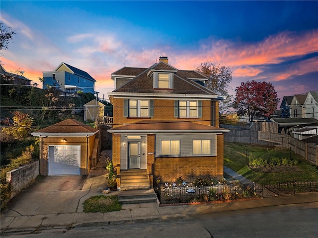 view of front of home with a fenced front yard, brick siding, a chimney, concrete driveway, and a garage