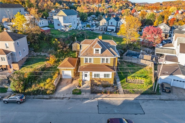 birds eye view of property with a residential view