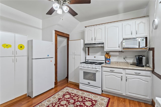 kitchen with light countertops, light wood-style floors, white cabinets, white appliances, and under cabinet range hood