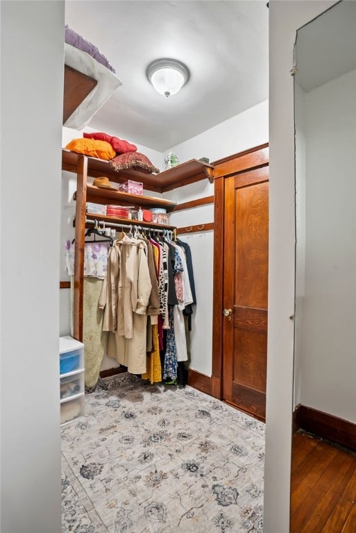 spacious closet featuring wood finished floors