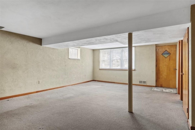 basement with carpet floors and visible vents