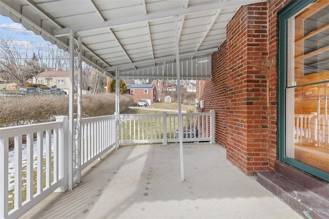 view of patio / terrace with a porch and a residential view