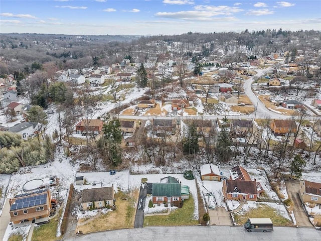 snowy aerial view featuring a residential view