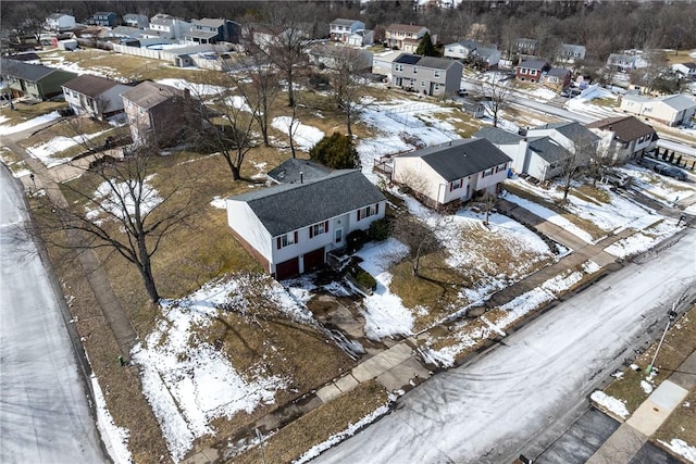 snowy aerial view featuring a residential view