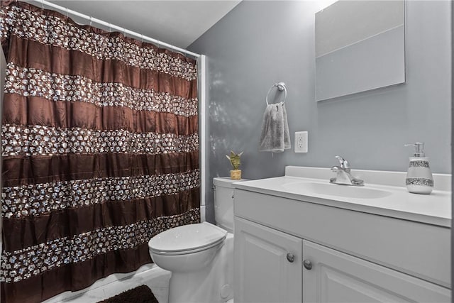 bathroom featuring toilet and vanity