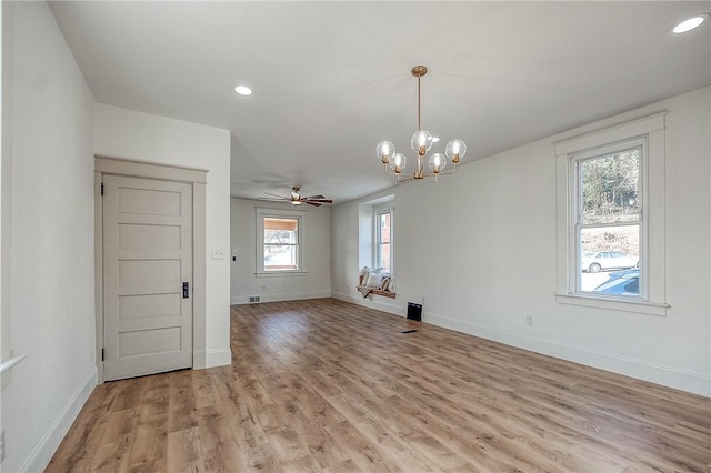 spare room with light wood-style flooring, baseboards, and recessed lighting