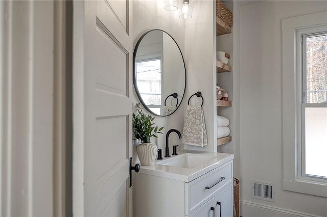 bathroom with vanity and visible vents