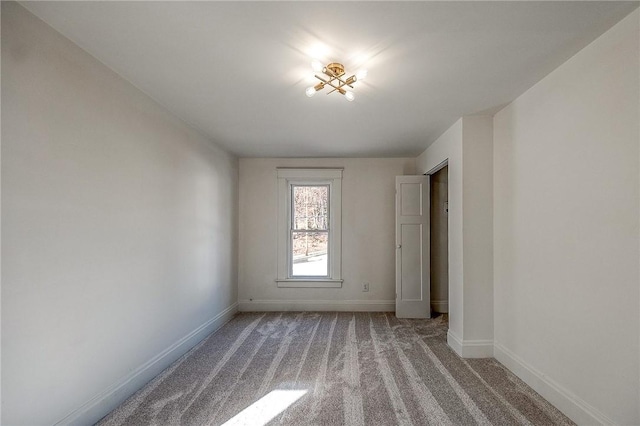 unfurnished bedroom with carpet and baseboards