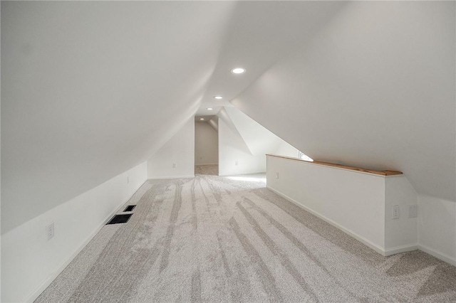 additional living space with lofted ceiling, carpet, baseboards, and recessed lighting