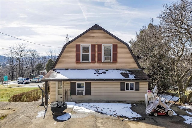 exterior space with a gambrel roof